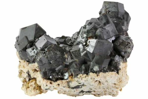 Jet black Melanite garnets from Imilchil, Morocco.